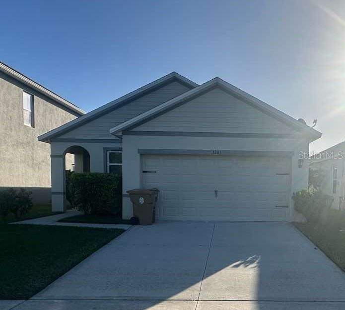 a front view of a house with garage