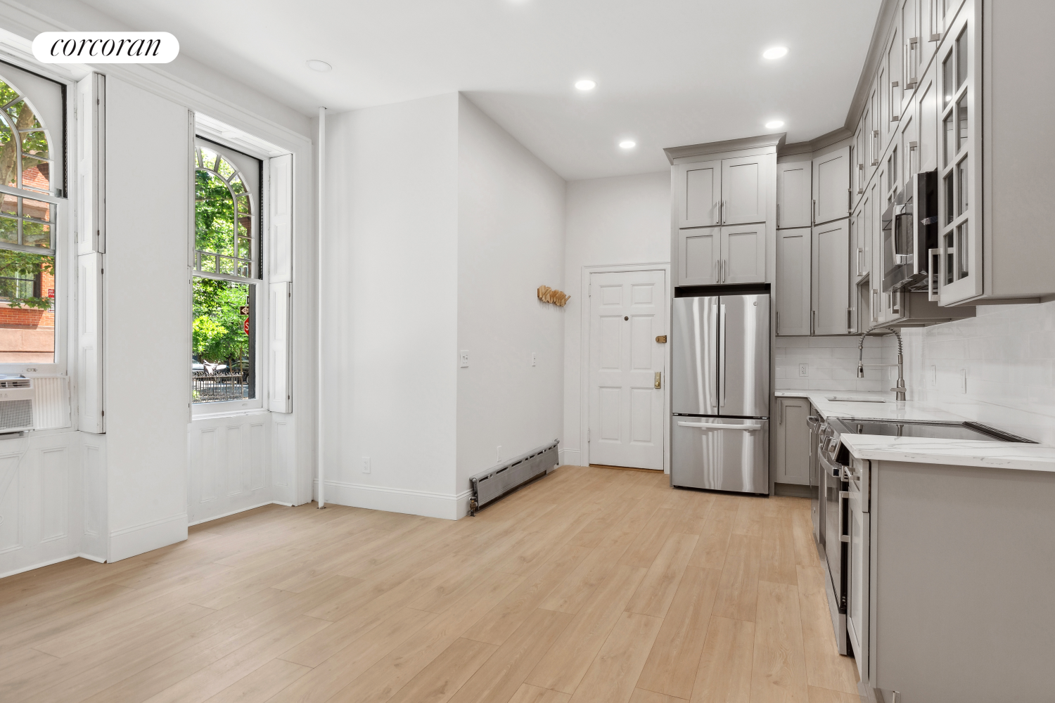 a view of a kitchen with a sink dishwasher and a refrigerator