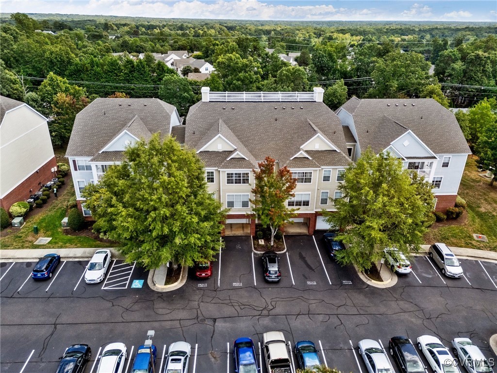 an aerial view of a house with yard swimming pool and outdoor seating