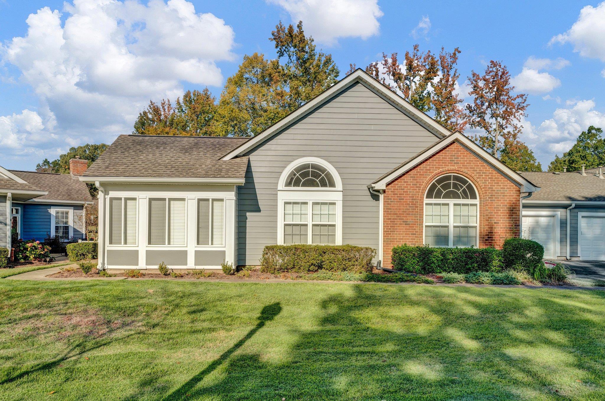 front view of a house with a yard