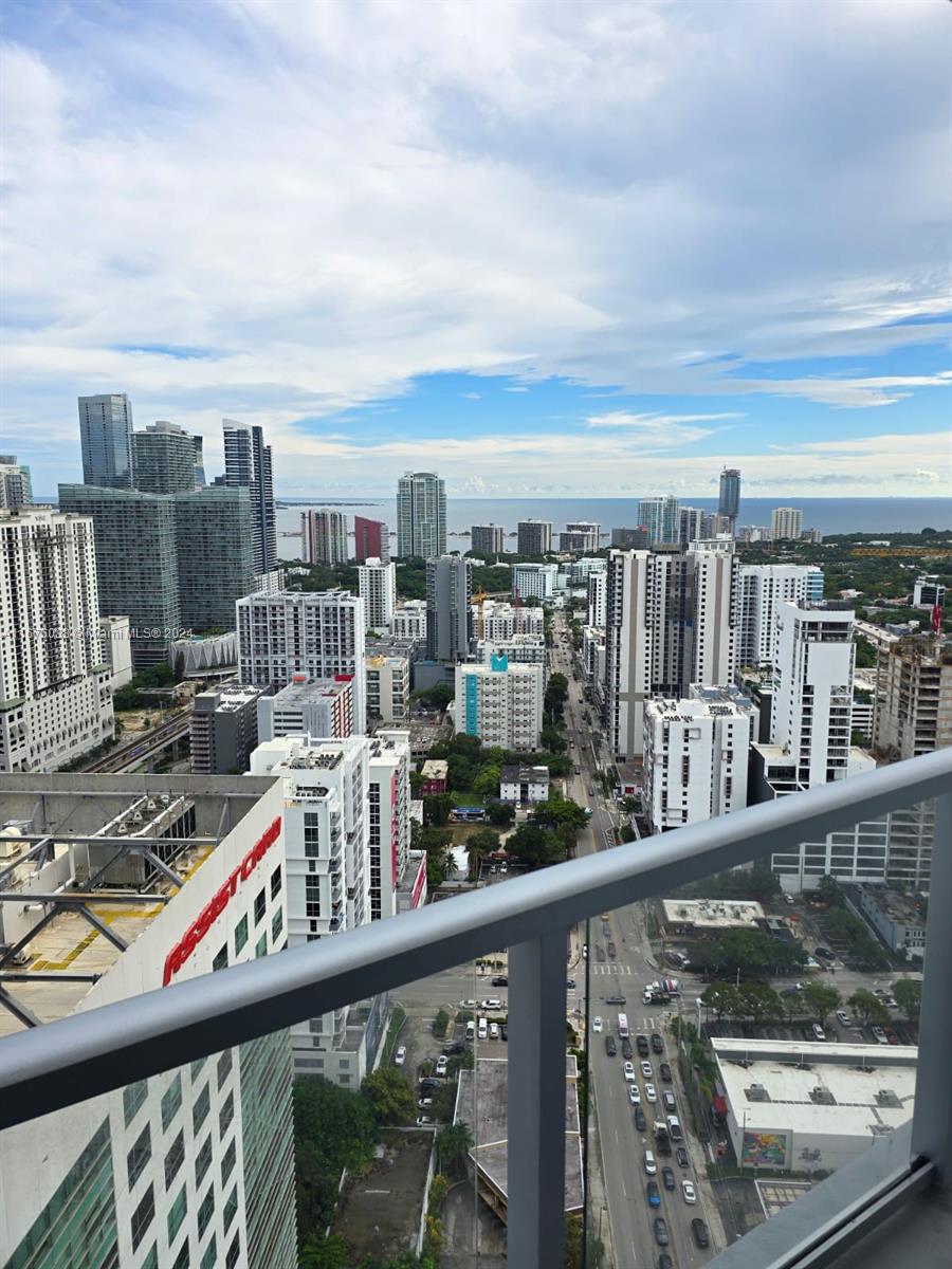 a view of a balcony with city view