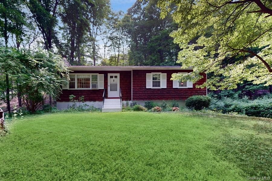 front view of a house with a yard