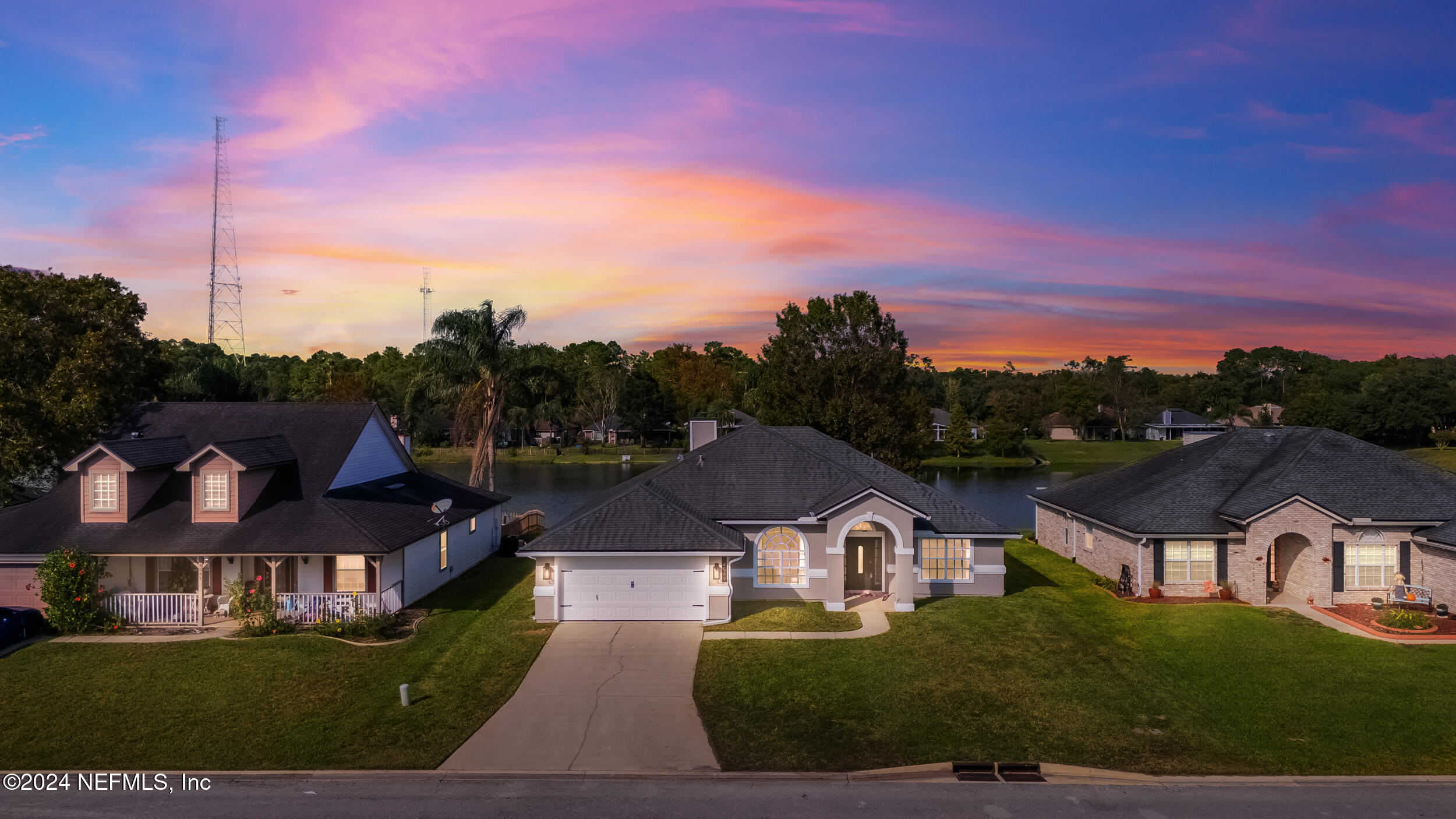 an aerial view of residential houses and city street