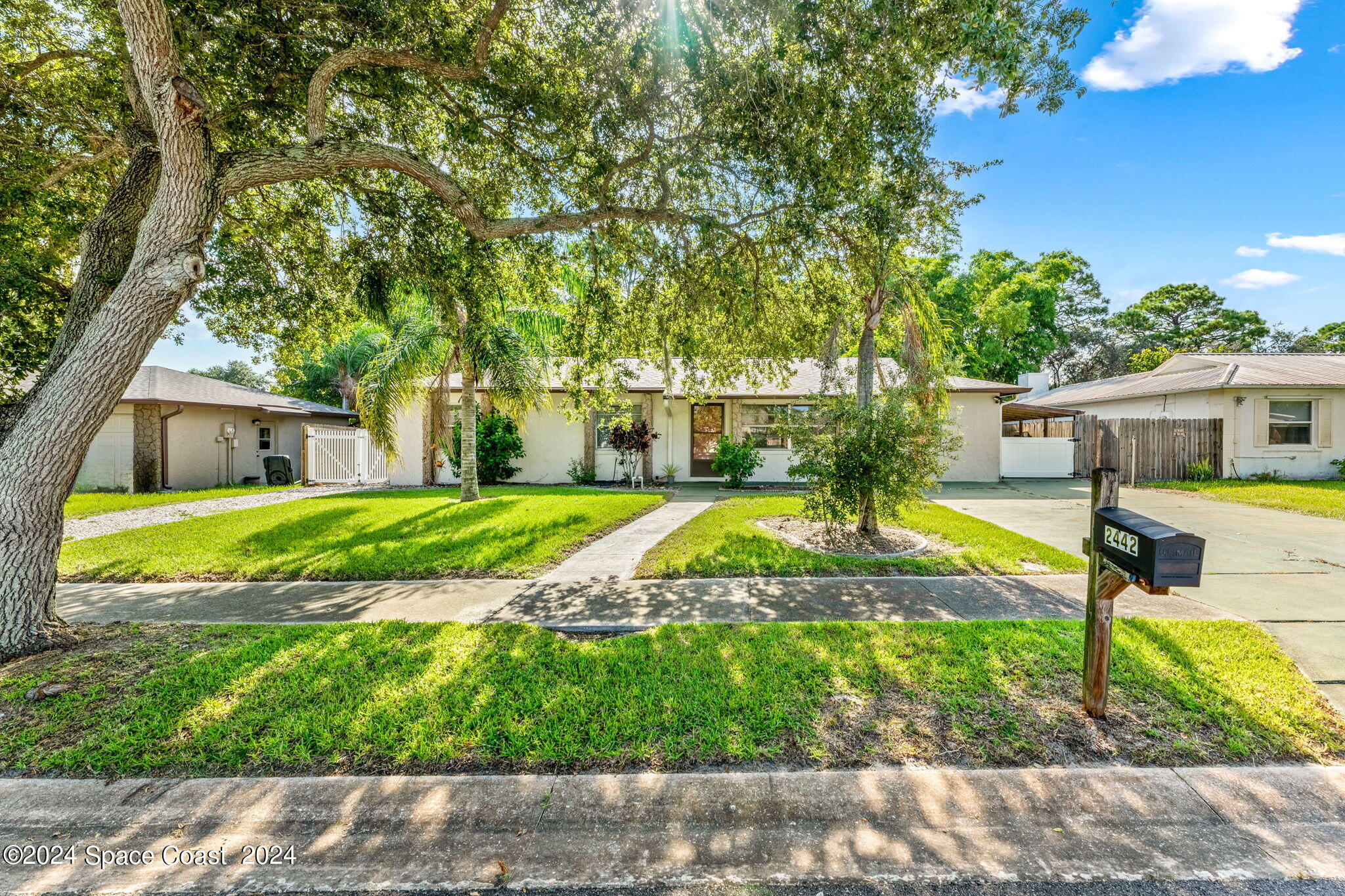 a view of house with swimming pool outdoor seating