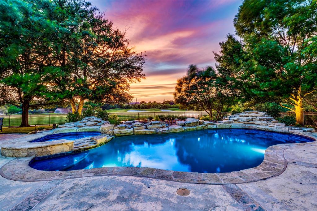 a view of a swimming pool with an outdoor space and seating area