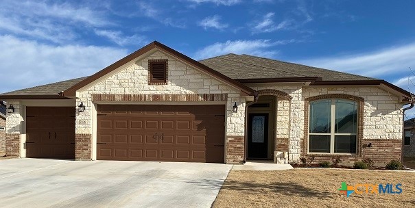 a front view of a house with a garage