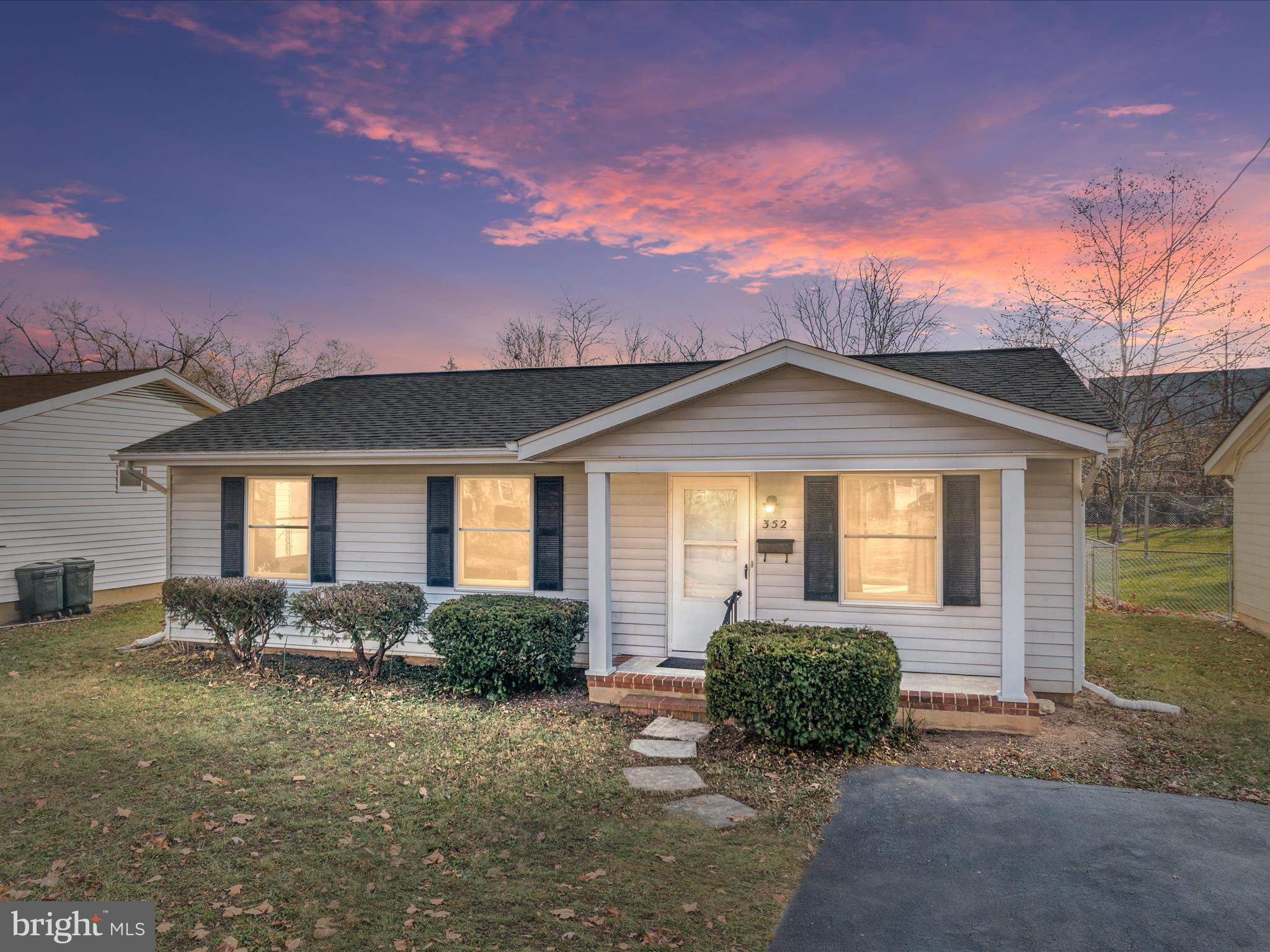 front view of a house with a yard