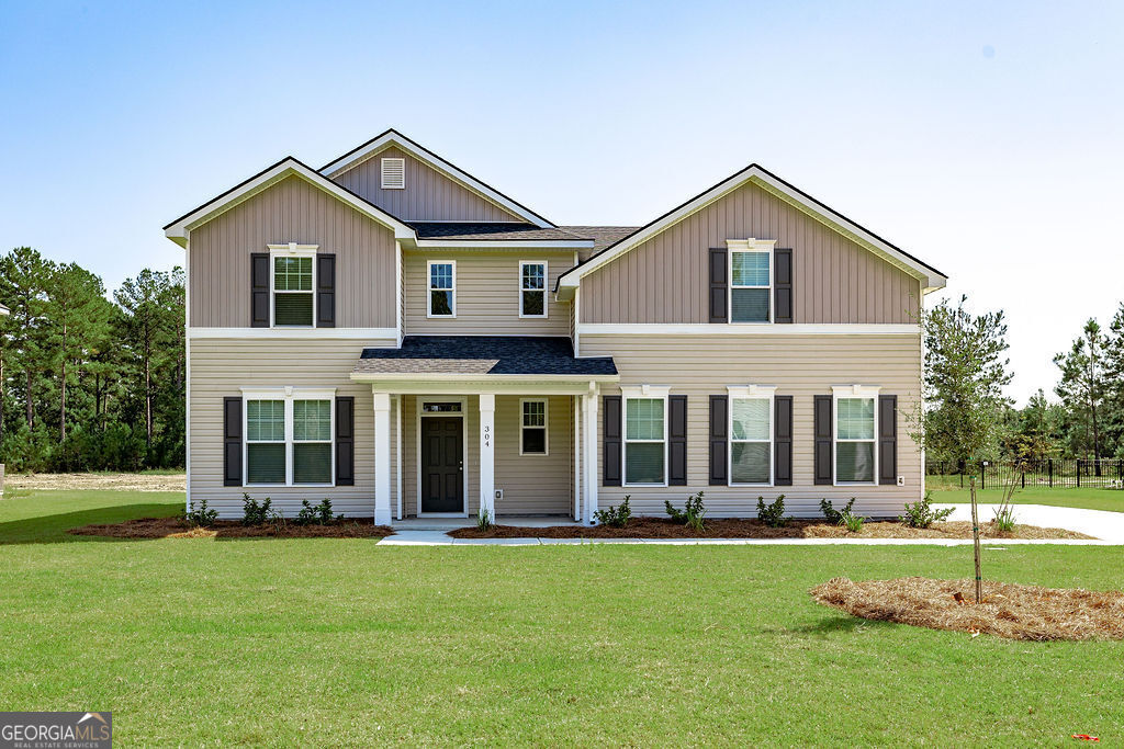 a front view of a house with a yard