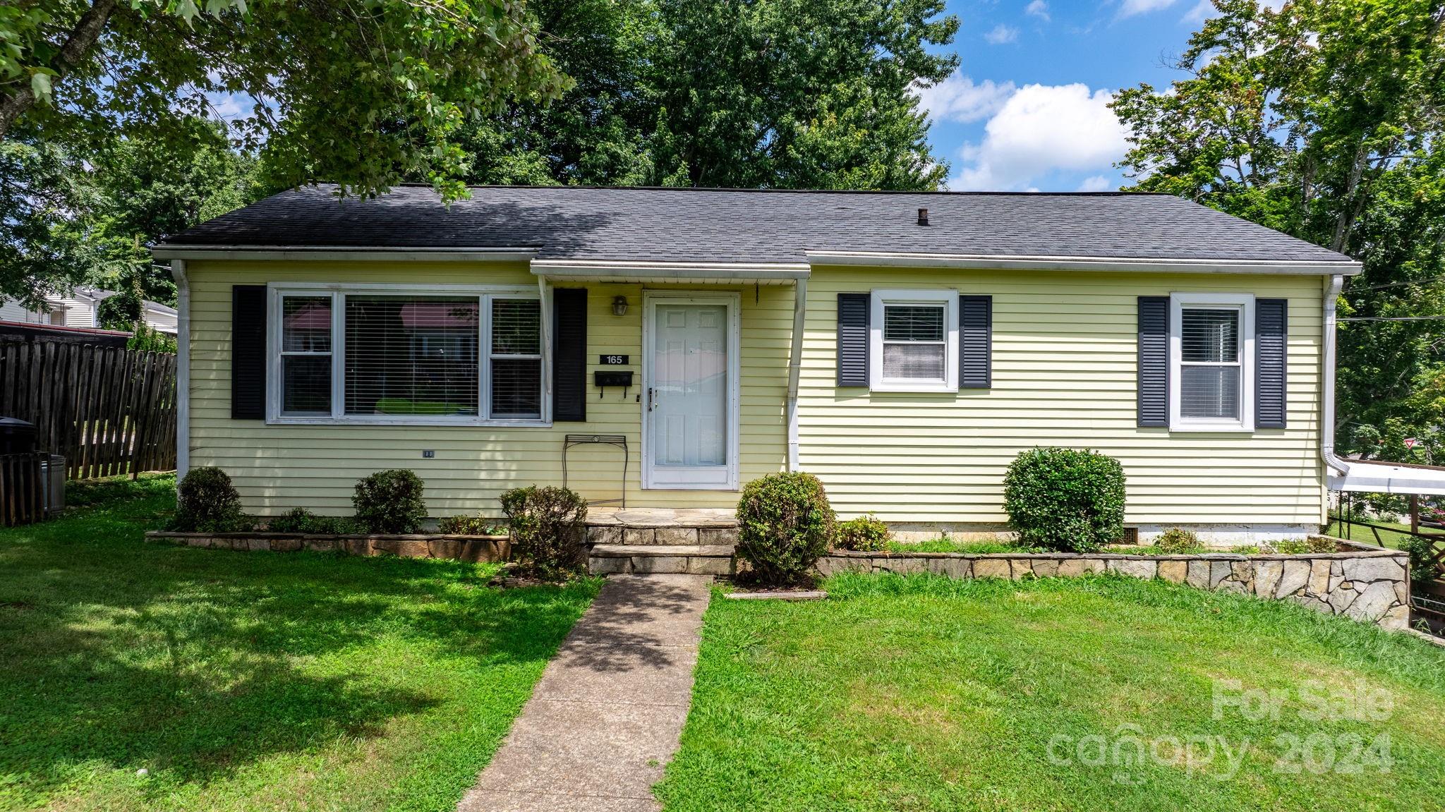 front view of a house with a yard