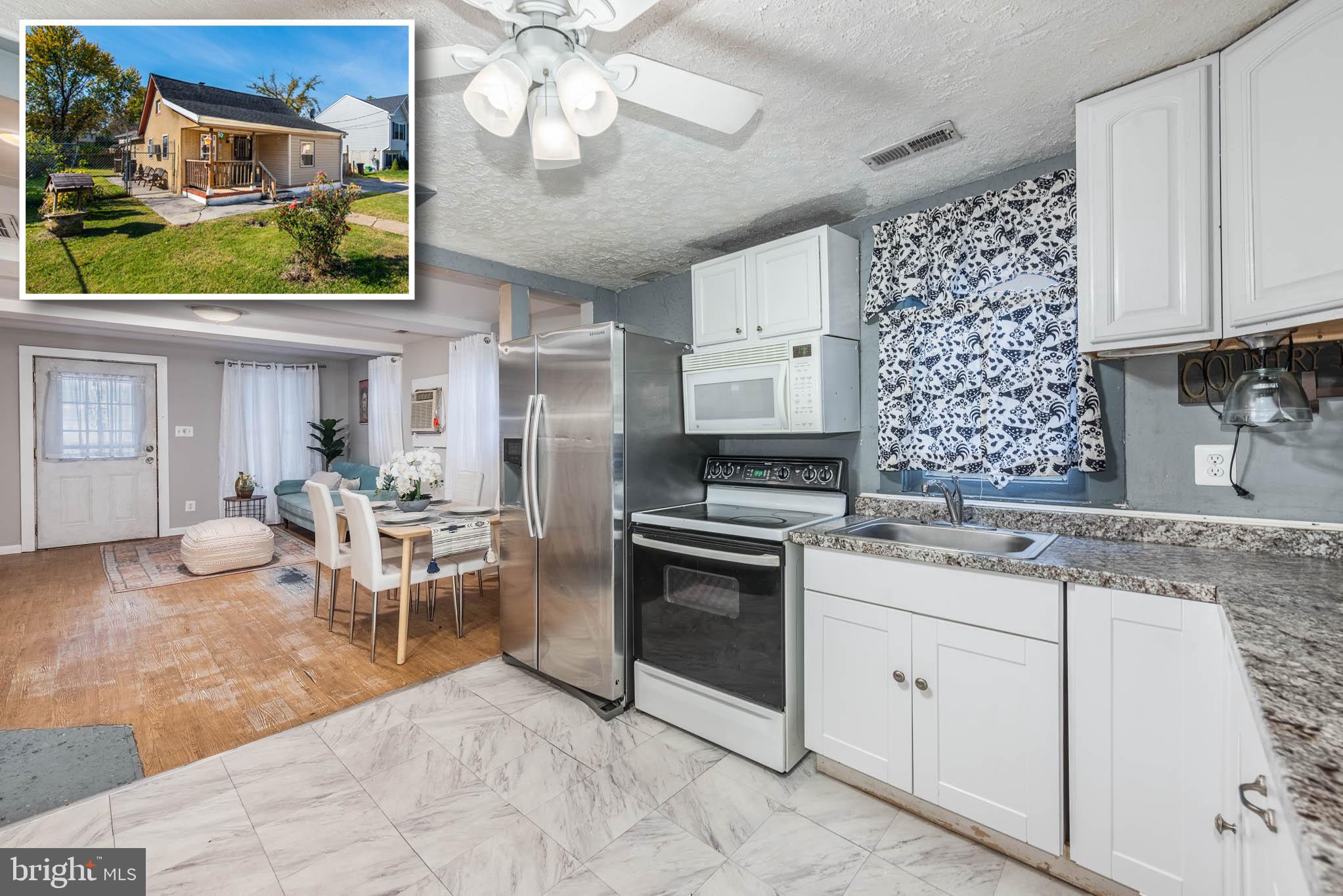 a kitchen with cabinets and chairs