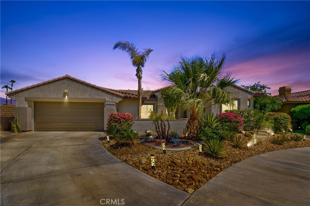 a front view of a house with yard