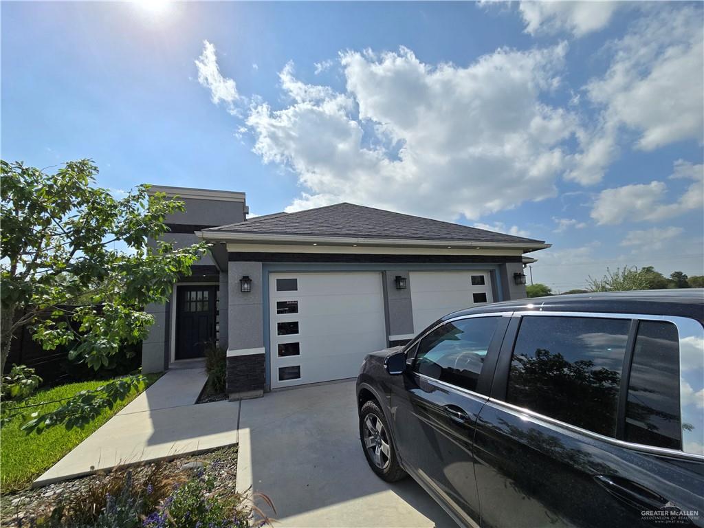 Prairie-style home with a garage