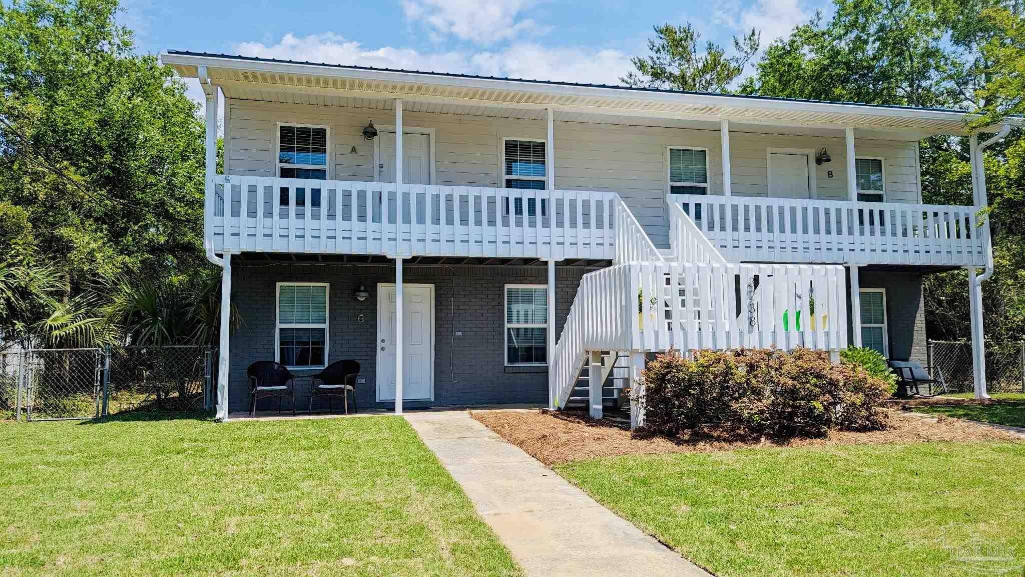 front view of a house with a yard