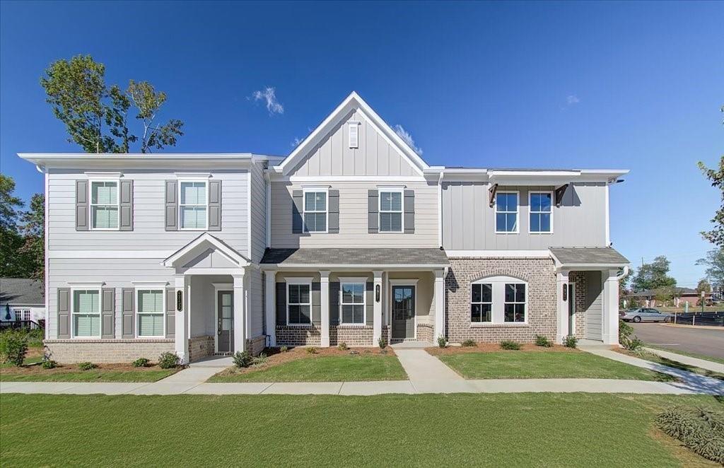 a front view of a house with a yard