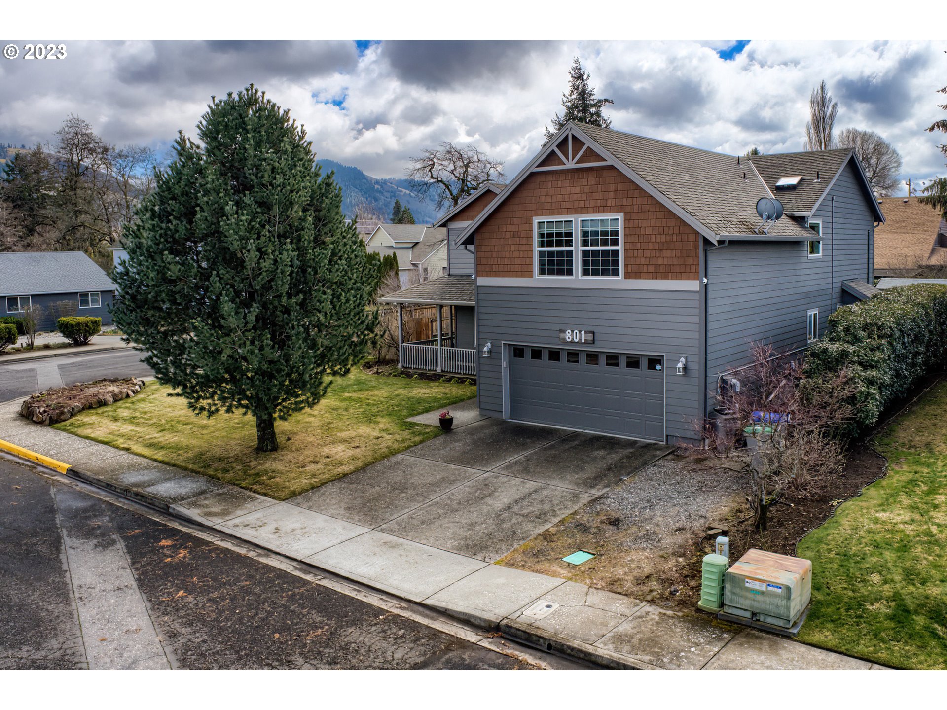 a front view of a house with trees