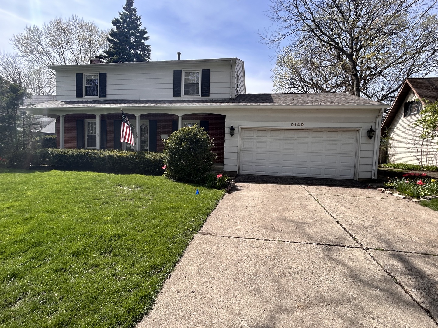 a view of a brick house with a yard