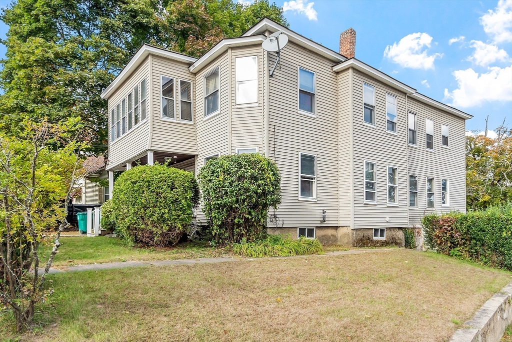 front view of a house with a yard