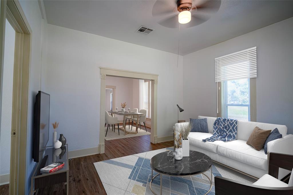 a living room with furniture and a table