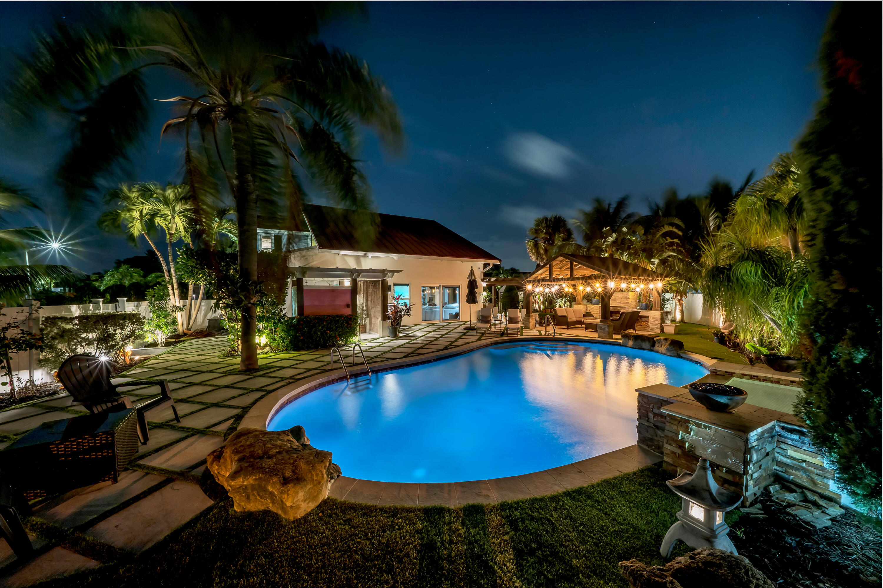 a view of a swimming pool with an outdoor seating