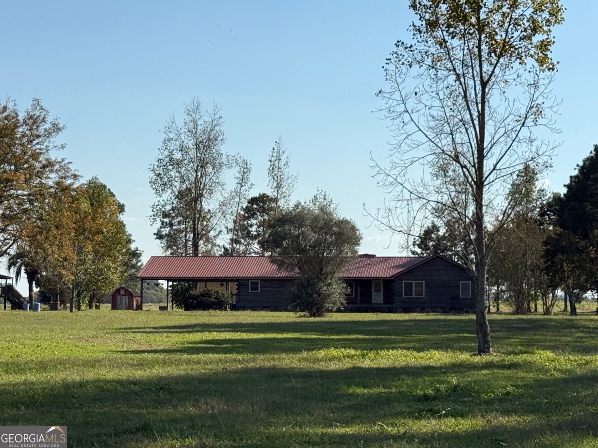 a view of a big yard next to a house