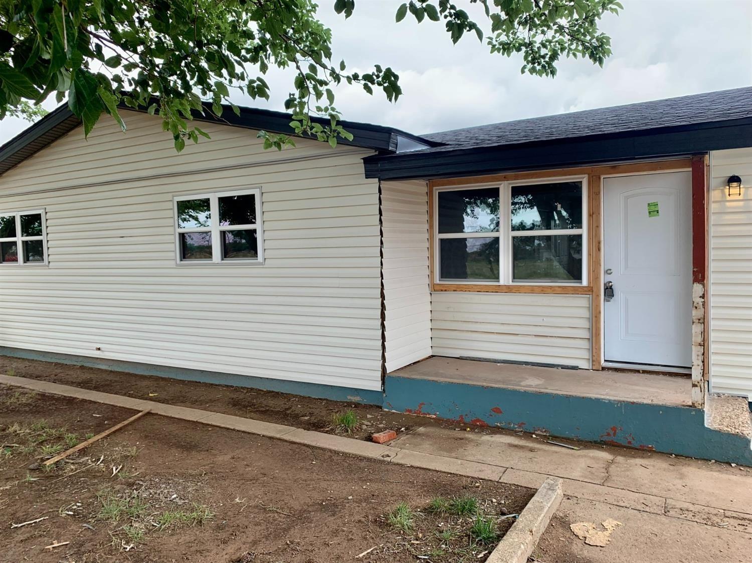 a view of a house with a garage