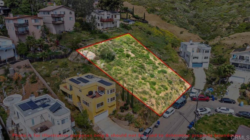 an aerial view of a residential houses with outdoor space