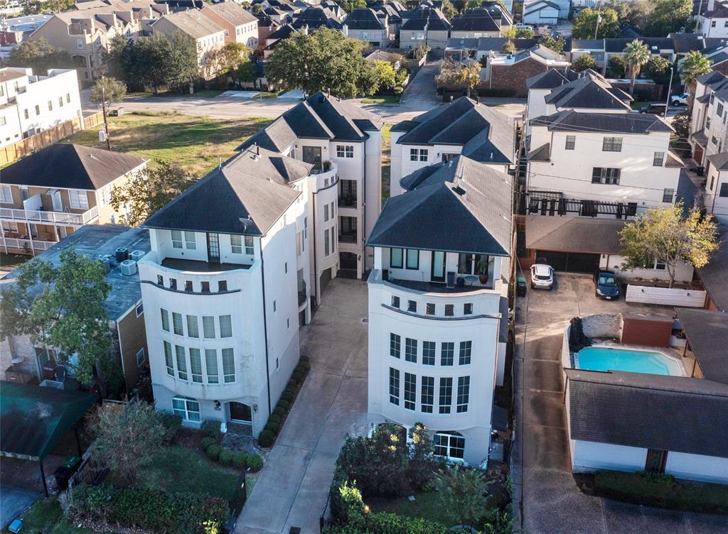 a aerial view of a house with a yard