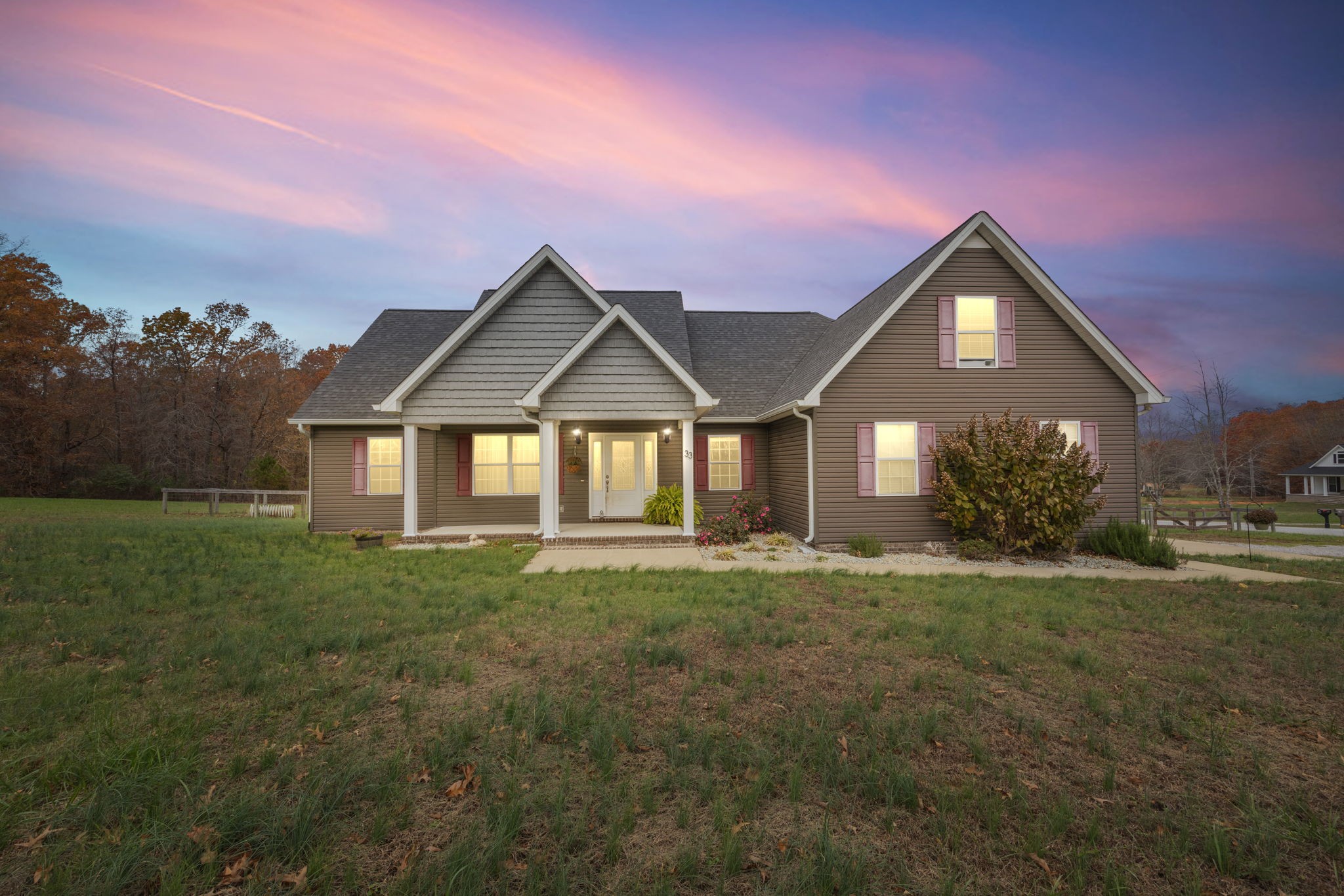 a front view of a house with a yard