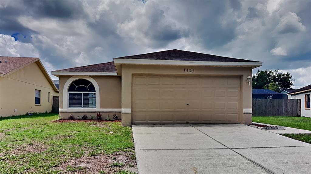 a front view of house with yard