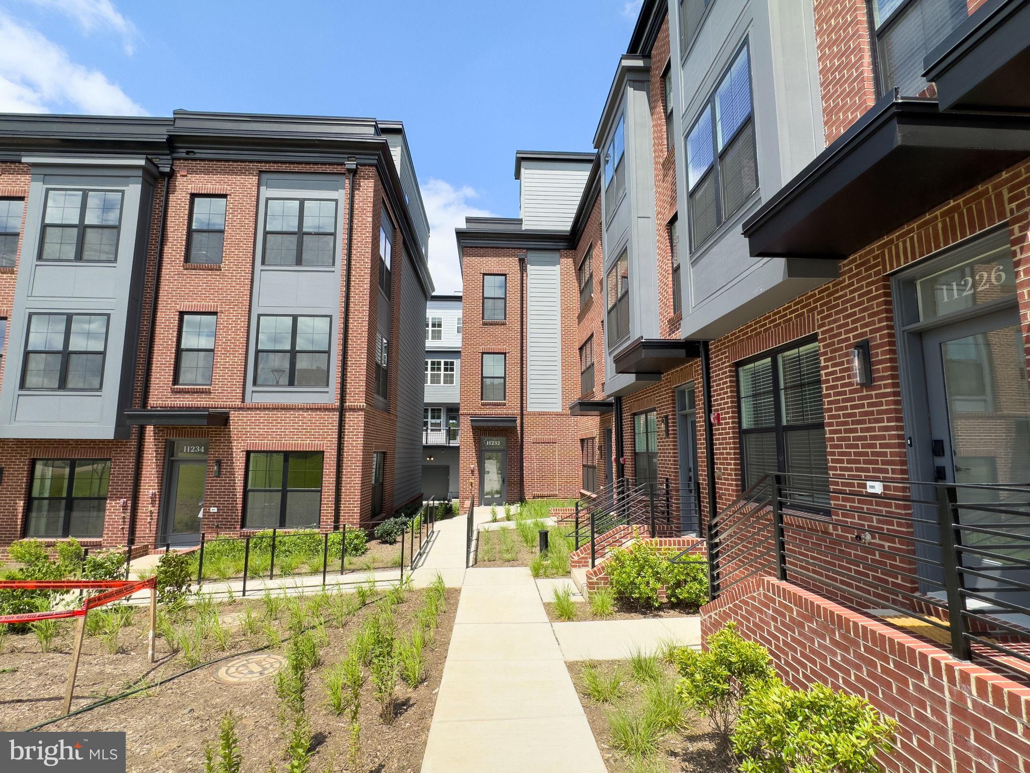 a view of a brick buidling front with many windows