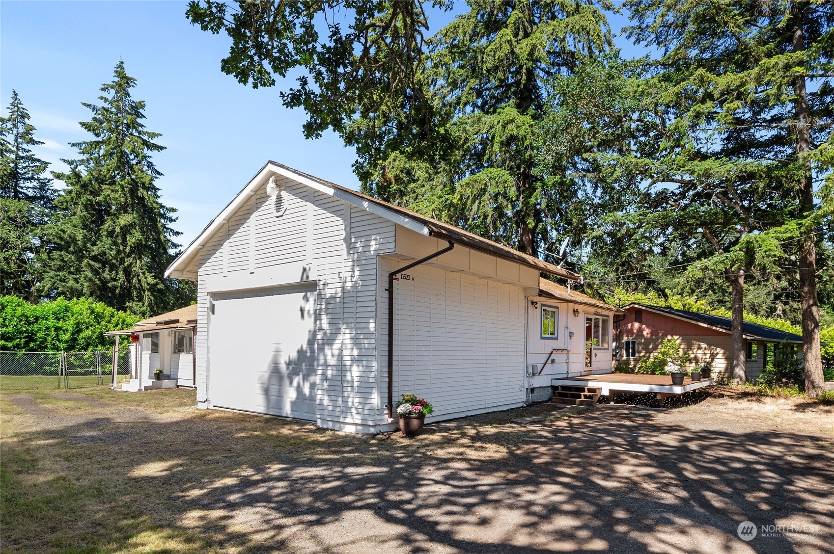 a view of a small house with a tree