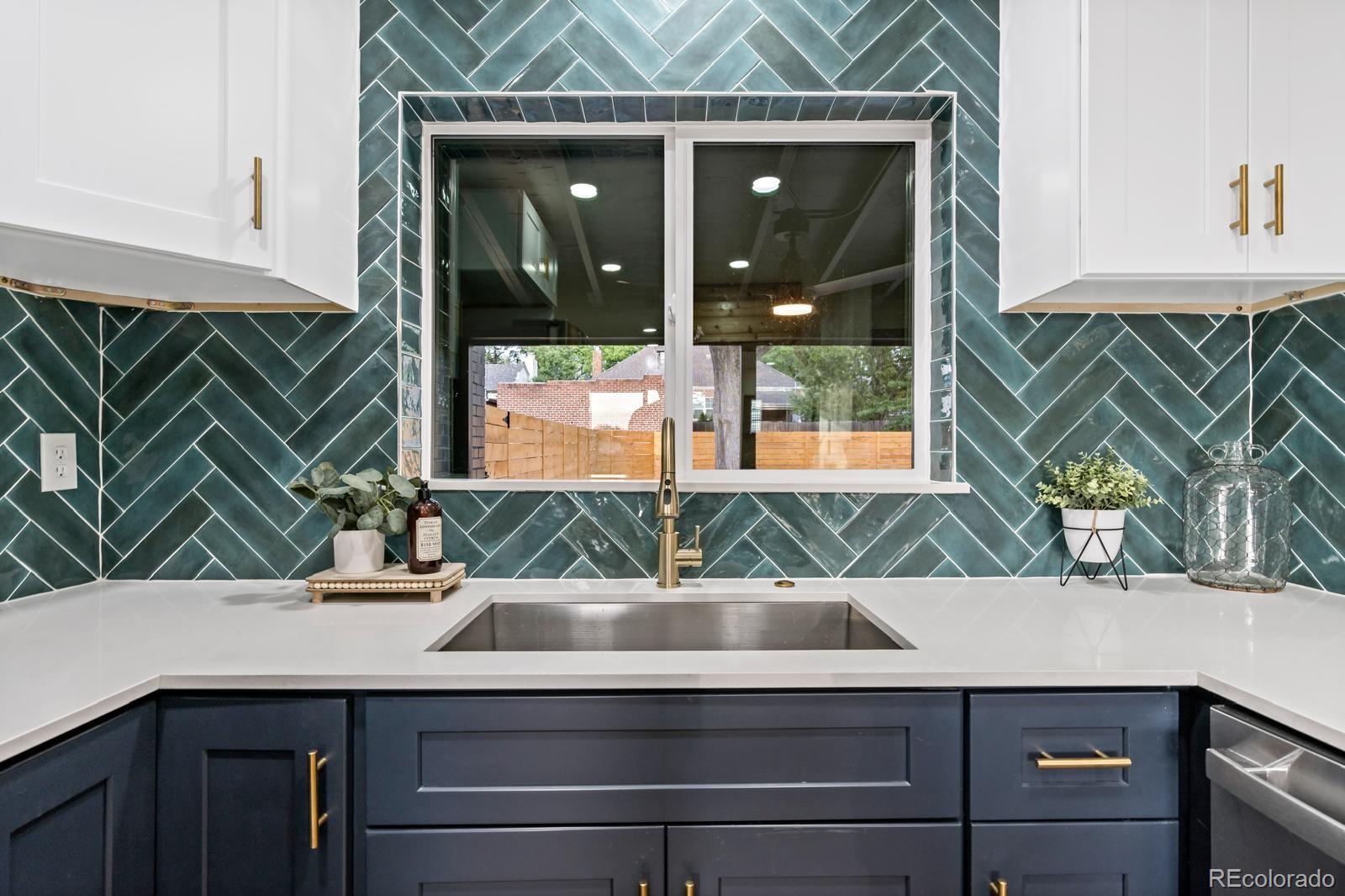 a kitchen with a sink and a window