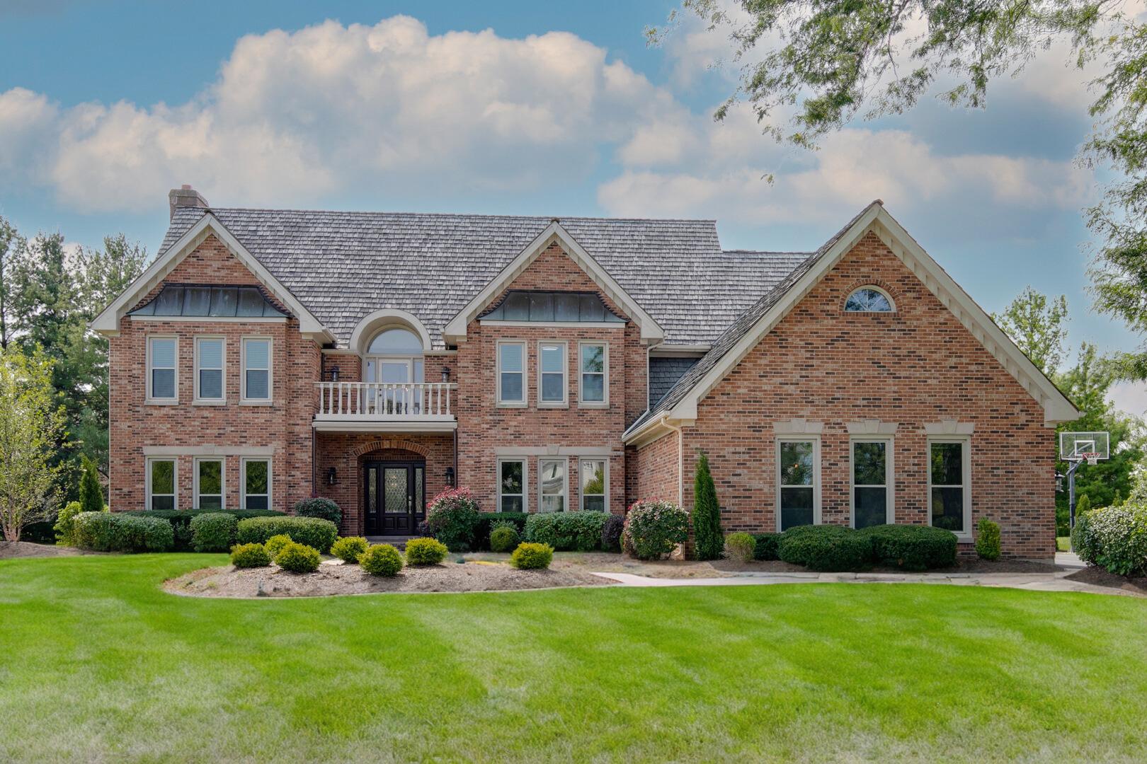 front view of a house with a yard