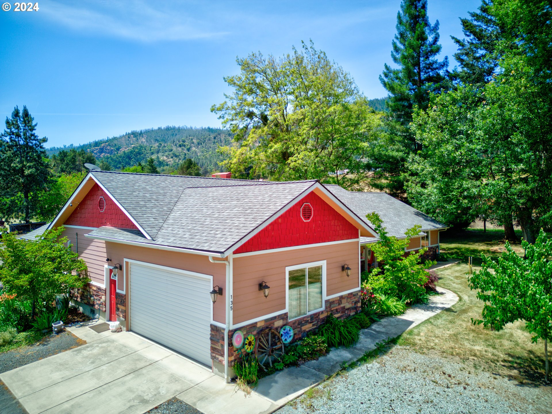 a aerial view of a house with a yard