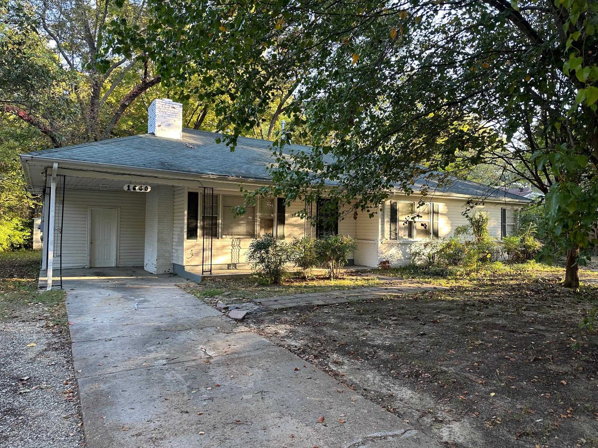 View of front facade with a carport