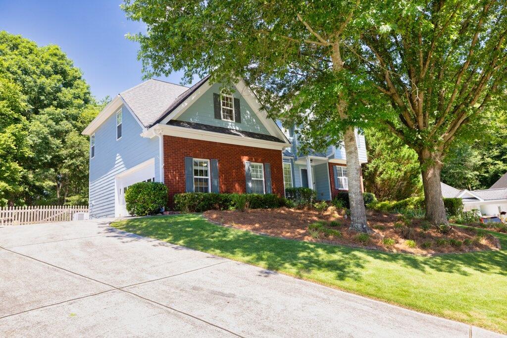 a front view of a house with a yard