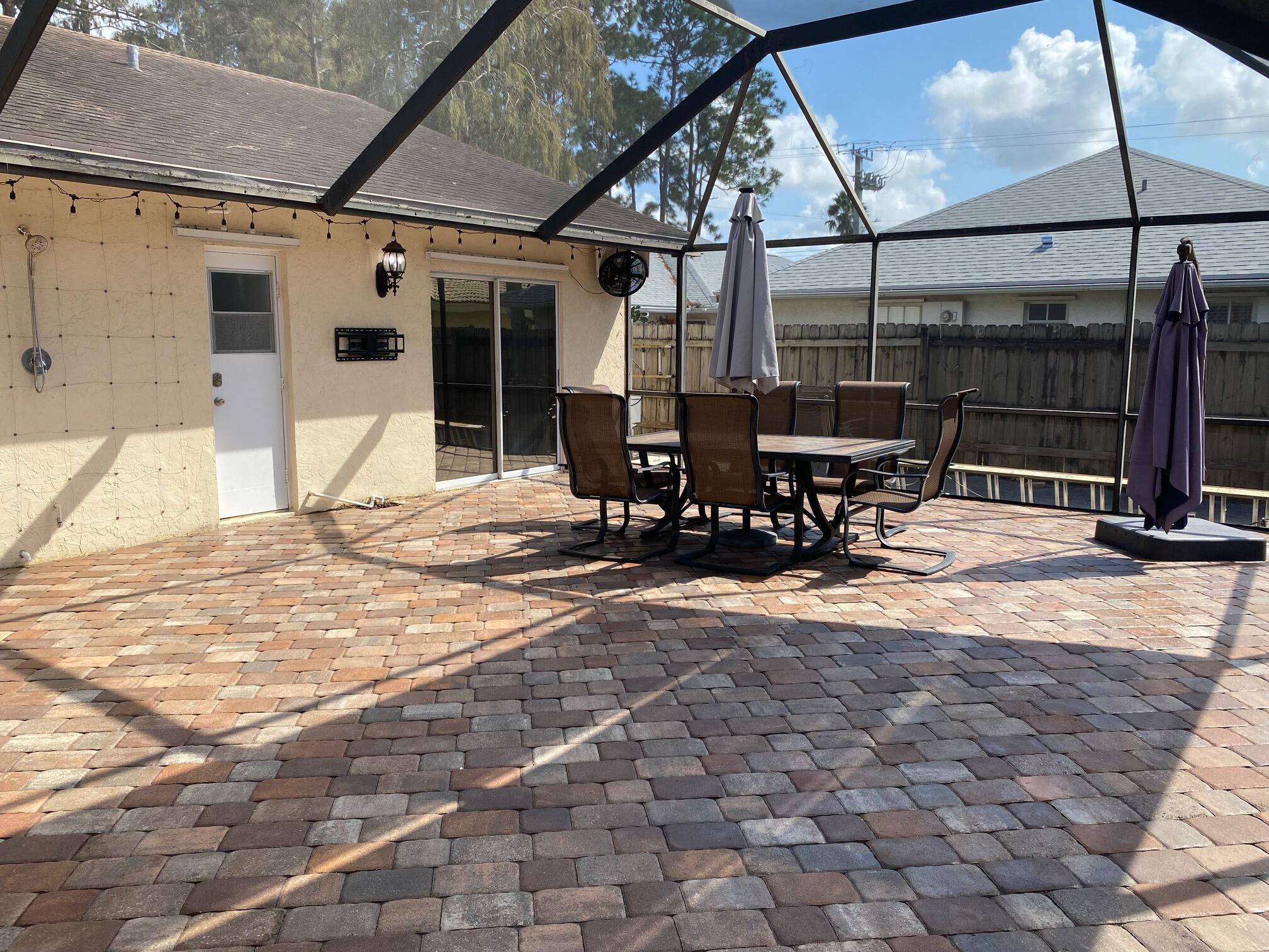 a view of a dinning table and chairs in the patio