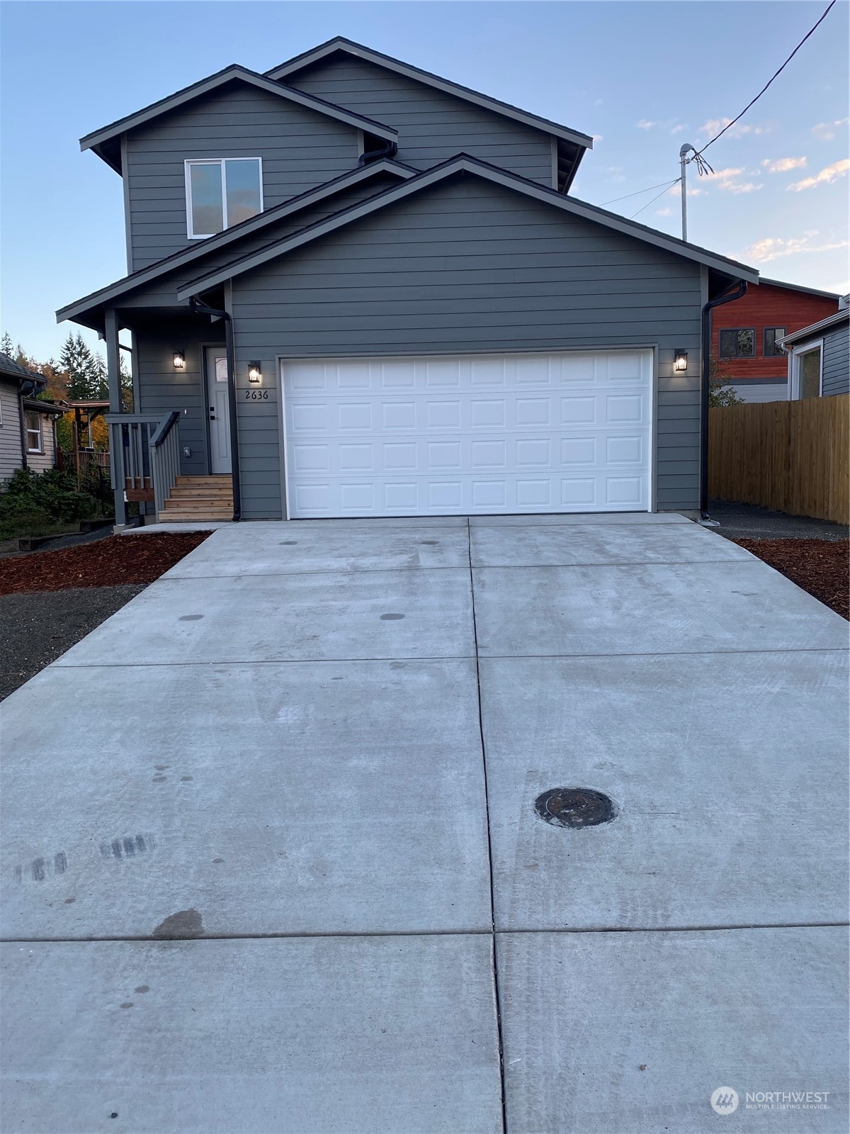 a front view of a house with garage