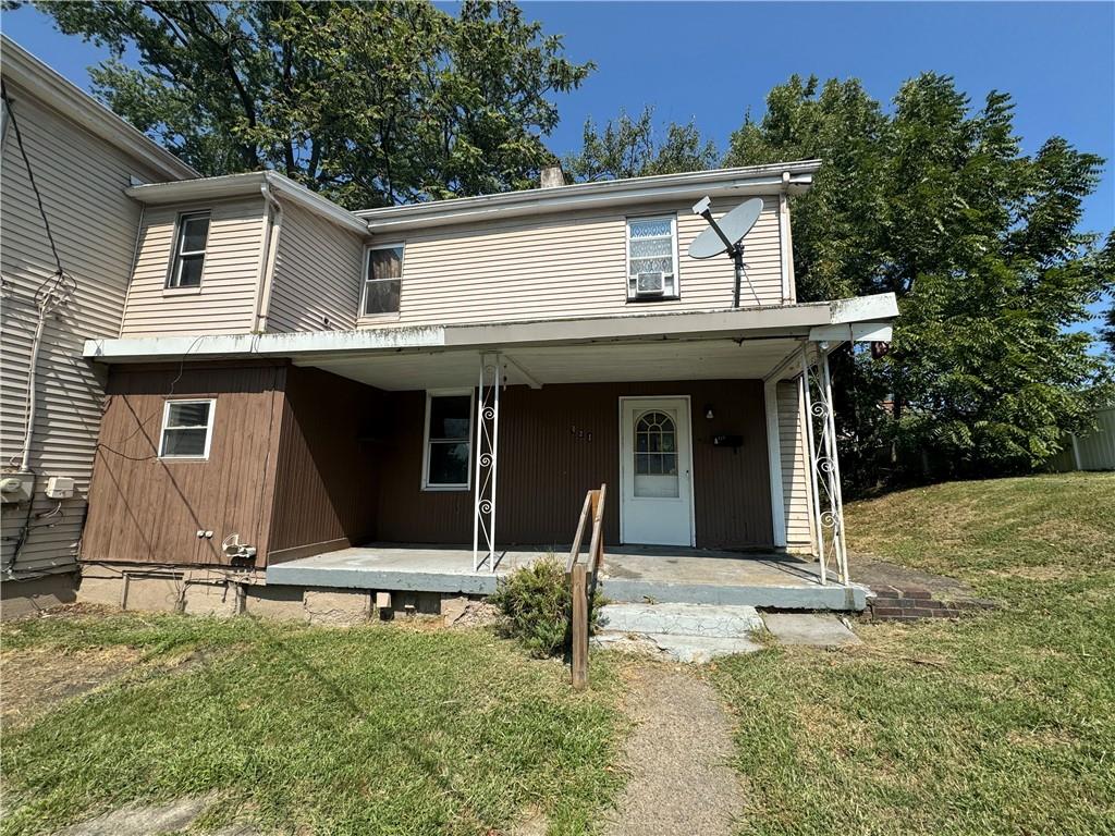 front view of a house with a yard