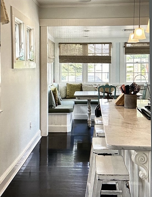 a living room with furniture and floor to ceiling windows