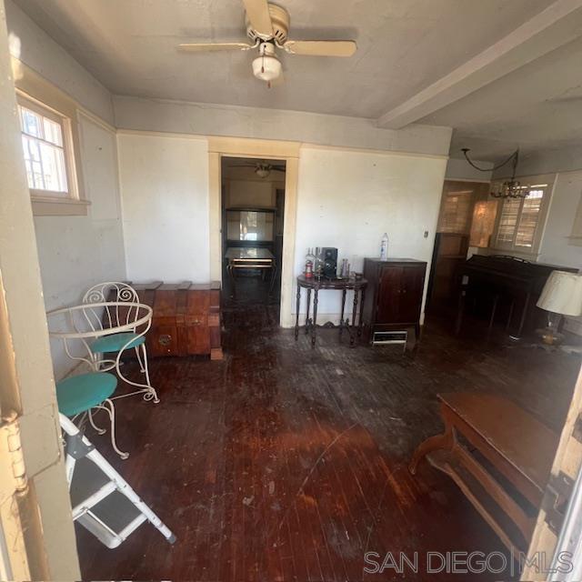 a room with wooden floor and furniture