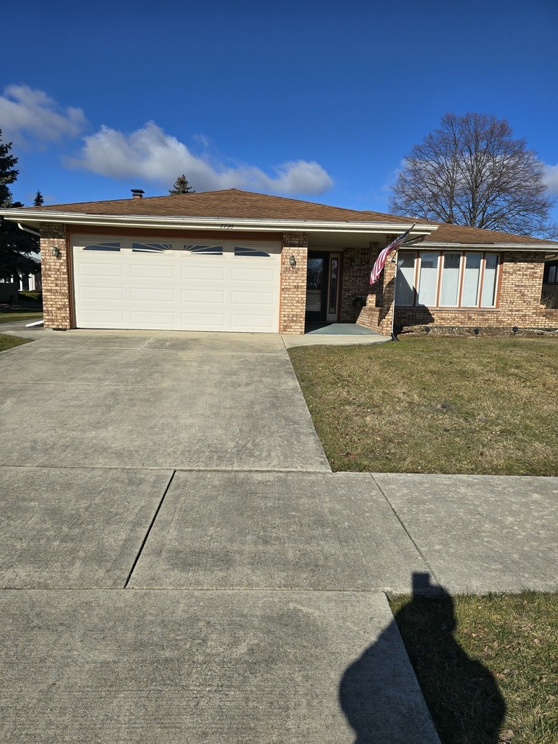 a view of a front door and a yard