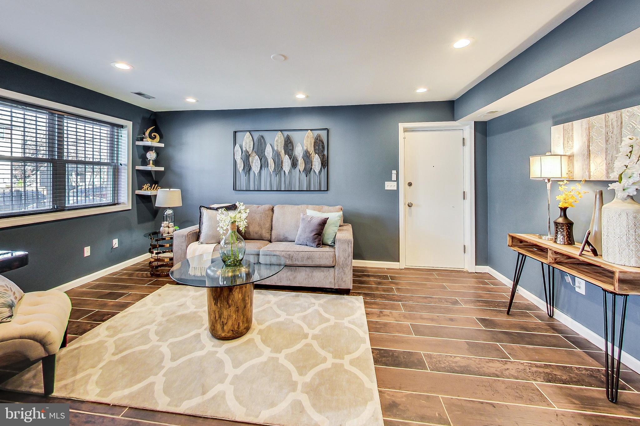 a living room with furniture and a table