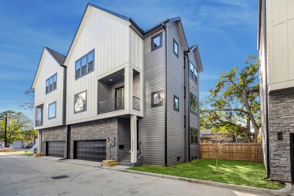 Each home offers a stunning two-toned Hardie exterior in Peppercorn Gray and Pure White, complemented by elegant stonework around the double car garage.