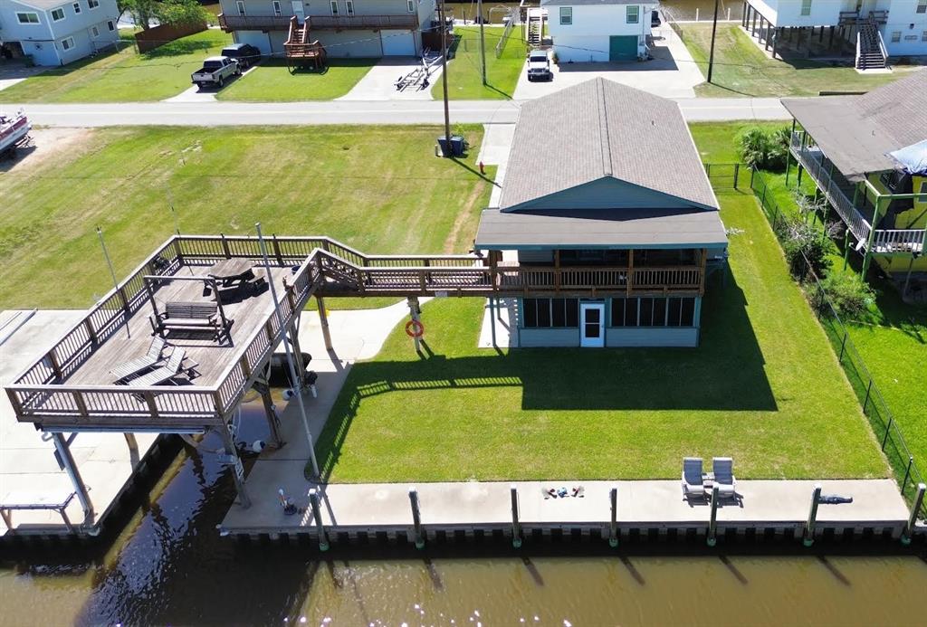 an aerial view of a house with a swimming pool