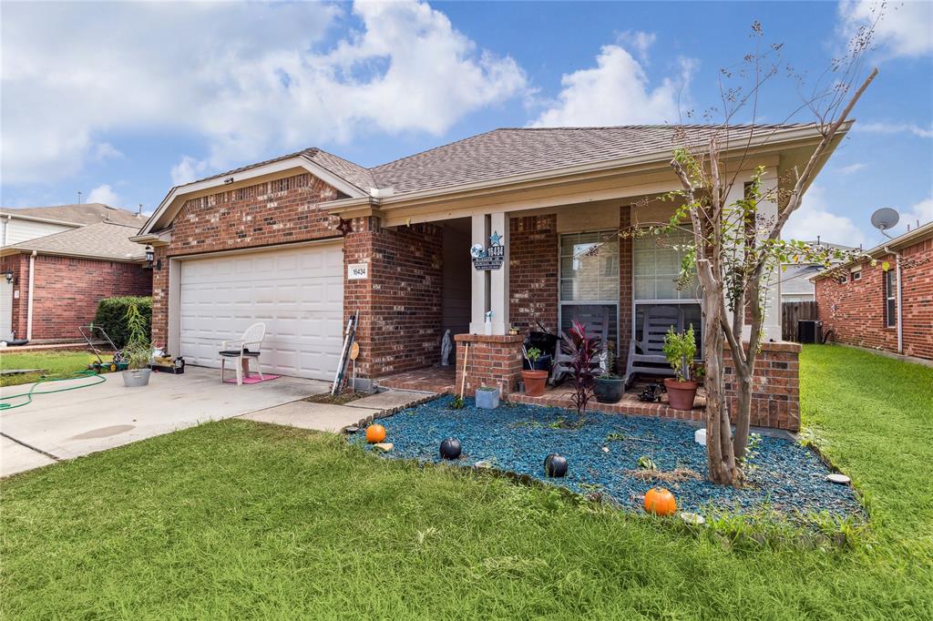 a view of a house with backyard sitting area and garden