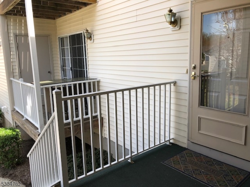 a view of a balcony with wooden floor