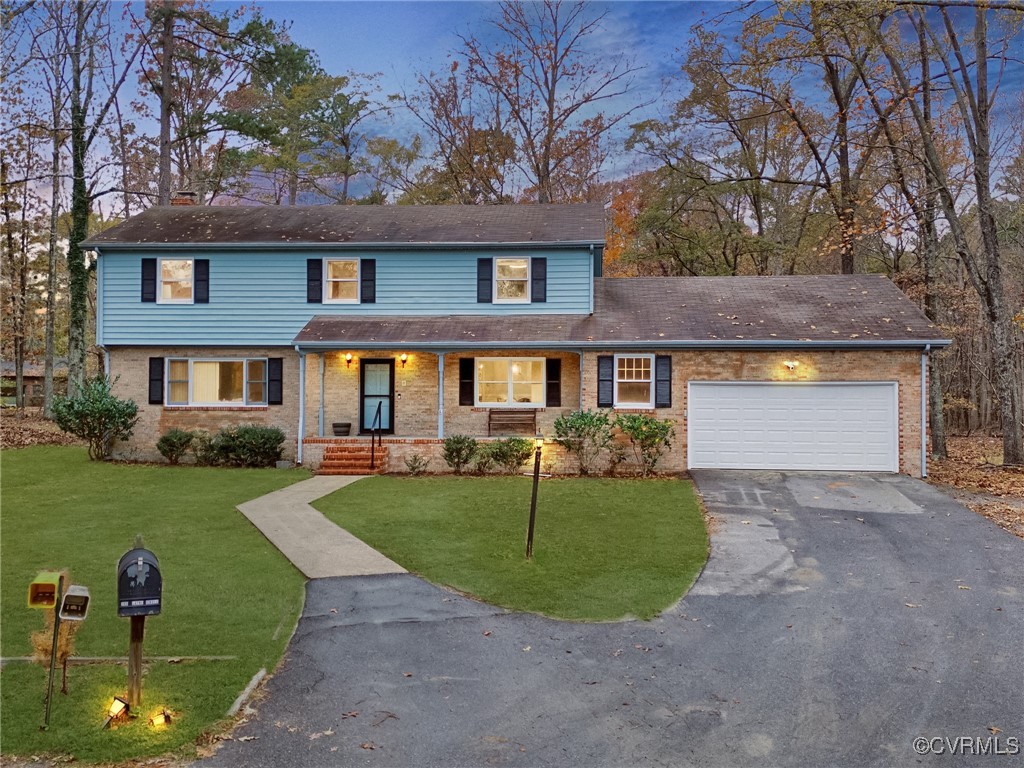 a front view of a house with garden and porch