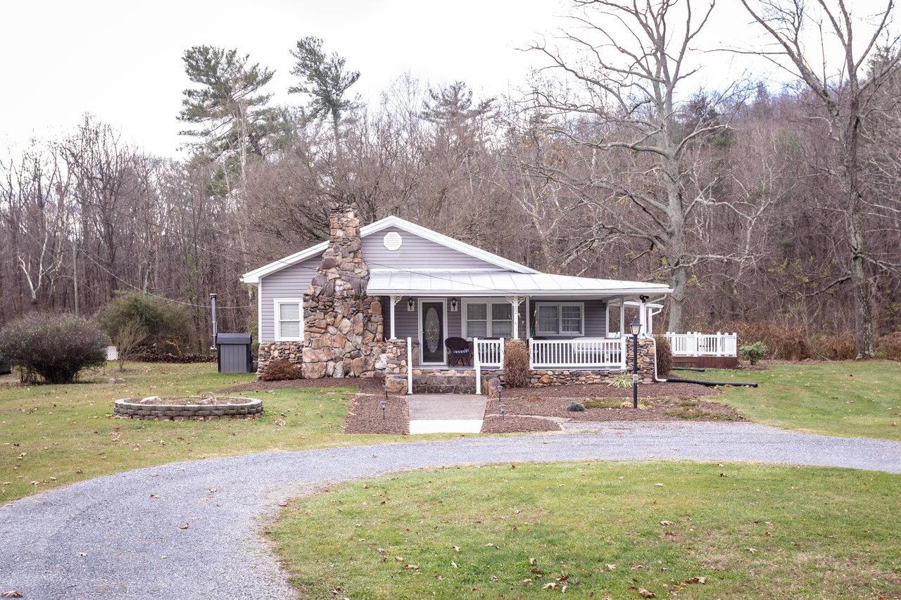 a backyard of a house with yard and tree s