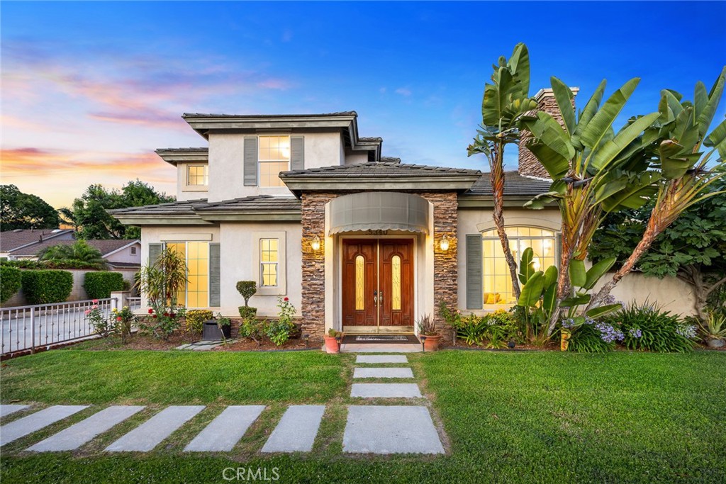 front view of a house with a yard